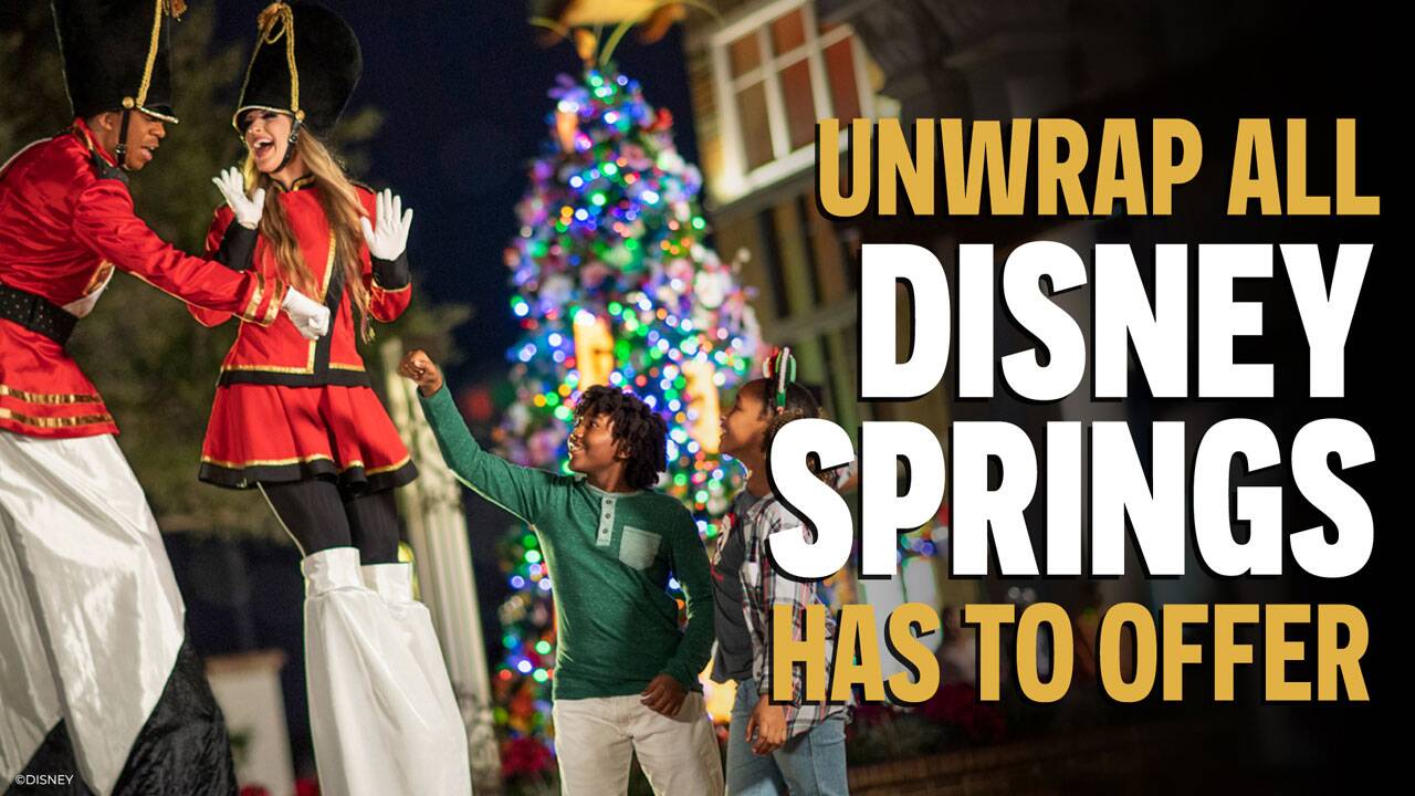 family at disney springs in a holiday themed vibe with a unwrap all disney springs has to offer