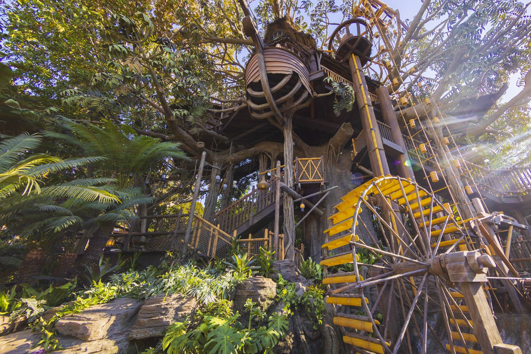 Paying tribute to the original treehouse that Walt Disney and his Imagineers built in 1962 for the movie “Swiss Family Robinson,” the Adventureland Treehouse inspired by Walt Disney’s Swiss Family Robinson will open in a fresh, new way Nov. 10, 2023, at Disneyland Park in Anaheim, Calif. The Adventureland Treehouse will showcase wondrous new environments created amongst the branches of a giant tree, where guests will once again enter by the giant waterwheel and follow the wood rope stairways up, up, up into the boughs. (Christian Thompson/Disneyland Resort)
