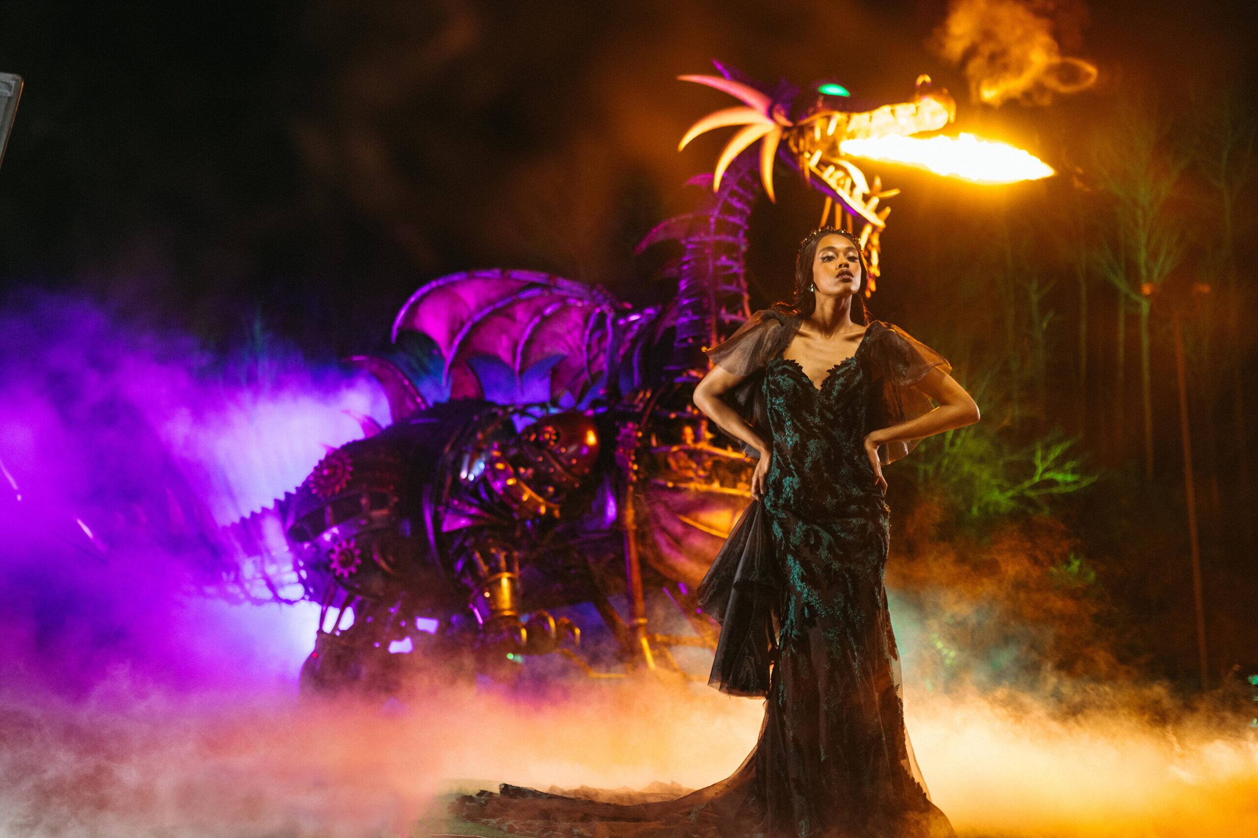 The new Disney’s Maleficent wedding gown is shown in Magic Kingdom Park at Walt Disney World Resort in Lake Buena Vista, Fla. It is one of four new gowns inspired by Disney Villains and introduced as part of the 2024 Disney’s Fairy Tale Weddings collection from Allure Bridals. Inspired by the villain from Disney’s “Sleeping Beauty,” the dress features shimmering green velvet embellishments and delicate lace appliques layered over black organza. The gown is also available in an ivory version, which offers chiffon lace accents for a softer touch. (Claire Celeste, Photographer)