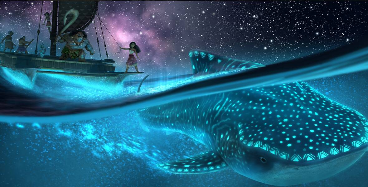 In an early image from Disney’s Moana 2, Moana, Maui, and several other characters are seen on a catamaran on the left, set against a darkened, starry night sky on the sea. Below them in the ocean, on the right, is a large whale.
